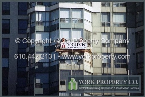 Professional oxidized curtain wall restoration cleaning contractor and restoring faded and bleached painted aluminum curtain wall window extrusions.
