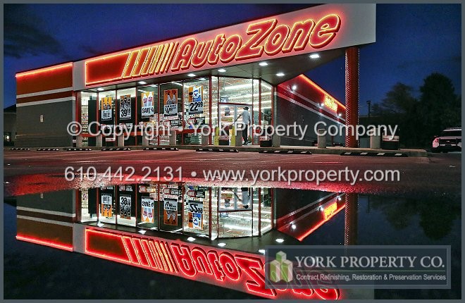 Refinishing faded painted aluminum storefront window frames.
