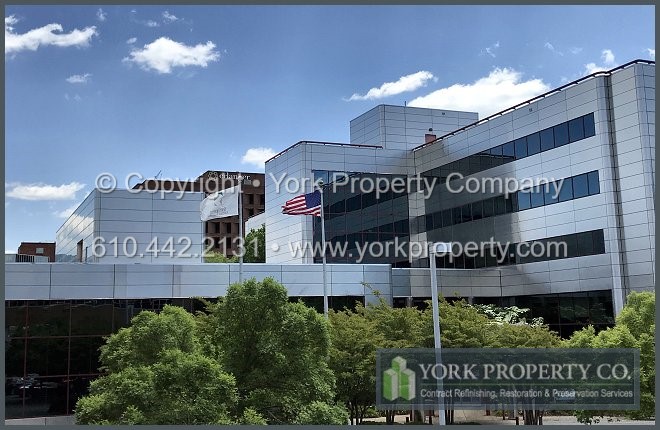 Dirty stainless steel building facade panel cleaning company.
